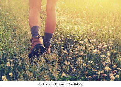 Young Woman Hiker Legs Walking On Trail In Grassland