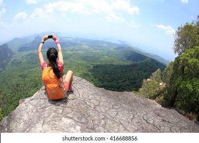 Young Woman Hiker Use Smartphone Taking Photo On Seaside Mountain Top