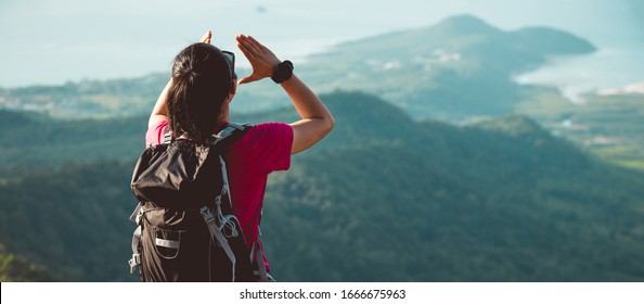 Young Woman Hiker Yelling At Mountain Top