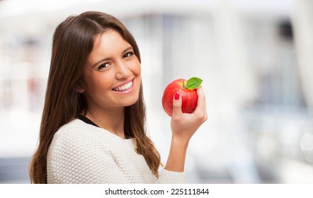 Young Woman Holding An Apple