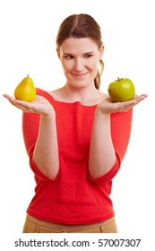 Young Woman Holding An Apple And A Pear