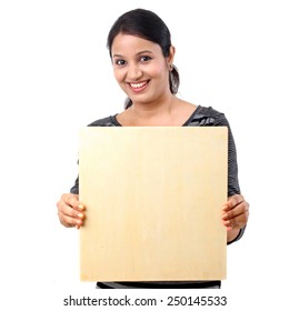 Young Woman Holding Blank Wooden Sheet