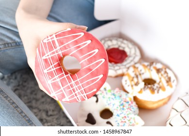 Young Woman Holding Box Of Delicious Donuts. Party Concept. No Diet. Candy Bar. Proper Nutrition Or Sweets, Dessert Fast Food. Unhealthy Lifestyle Concept. Doughnuts From Food Delivery.