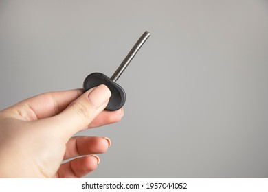 Young Woman Holding Broken House Key.