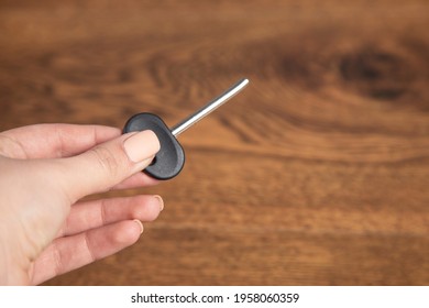 Young Woman Holding Broken House Key.