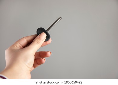 Young Woman Holding Broken House Key.