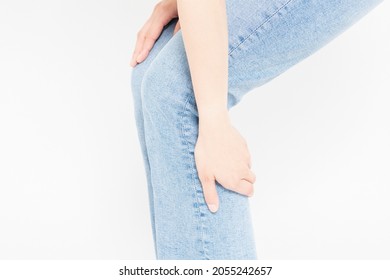 Young Woman Holding Calf In Front Of White Background