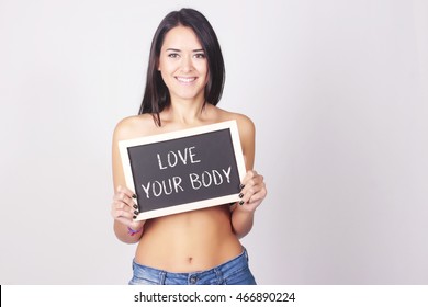 Young Woman Holding Chalkboard That Reads Love Your Body. Self Love Concept.