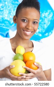 Young Woman Holding Citrus Fruit In Studio