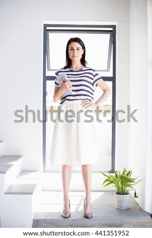 Similar – young beautiful lady posing in the living room next to a window