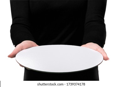 Young Woman Holding Dish Plate White In Her Hand. Girl In Black Shirt Is Holding An Empty White Round Plate