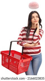 Young Woman Holding An Empty Shopping Basket And Thinking And A Brain Floating Above Her Head Isolated On White Background