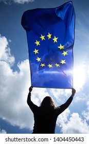 Young woman holding European Union flag. Voting, election concept. - Shutterstock ID 1404450443