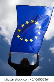 Young woman holding European Union flag. Voting, election concept. - Shutterstock ID 1406005364