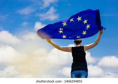 Young woman holding the European Union Flag. Voting concept. - Shutterstock ID 1406294855