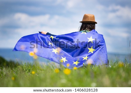 Young woman holding European Union flag. Voting, election concept.