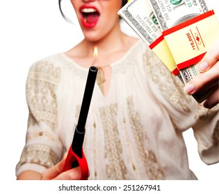Young Woman holding a flame against money