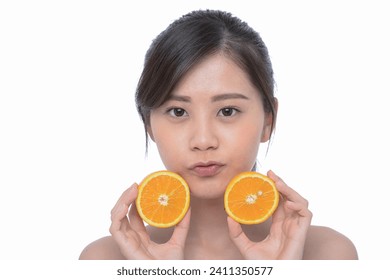 young woman holding fresh juicy slice oranges. Healthy lifestyle.

 - Powered by Shutterstock