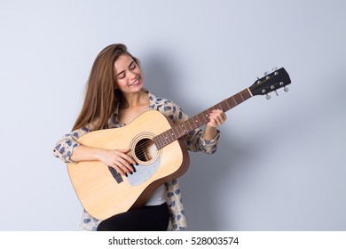 Young Woman Holding Guitar Stock Photo 528003574 | Shutterstock