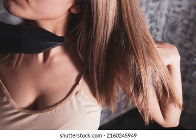 Young Woman Holding Hair Dryer