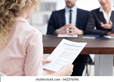 Young Woman Holding Her Resume During Job Interview