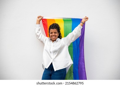 Young Woman Holding Lgtb Flag On White Background