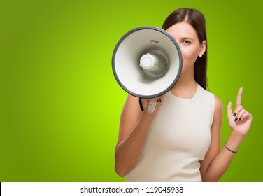 Young Woman Holding Megaphone against a green background - Powered by Shutterstock