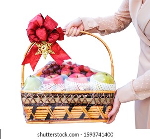 Young Woman Holding New Year Fruit Gift Basket Isolated On White Background