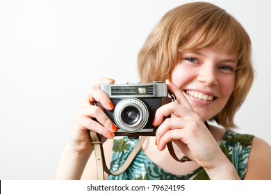 Young Woman Holding An Old Vintage Camera