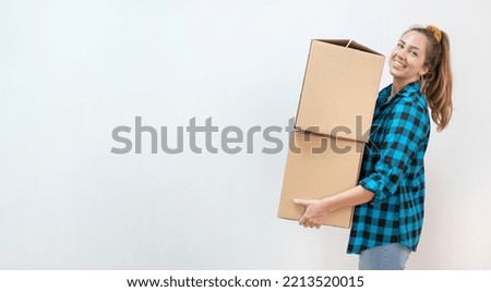 Young woman holding package, carrying box. Horizontal banner with empty copy space isolated background.Real estate, rental, buy, rent, moving, new house concept.