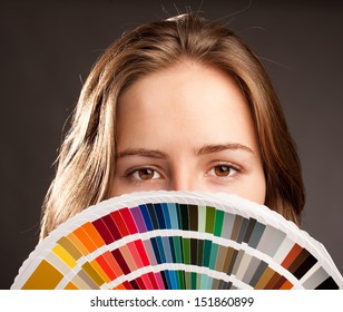 Young Woman Holding A Pantone Palette