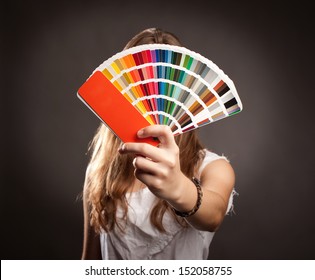 Young Woman Holding A Pantone Palette