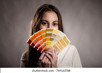 Young Woman Holding A Pantone Palette