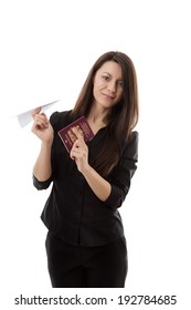 Young Woman Holding A Paper Airplane And A British Passport