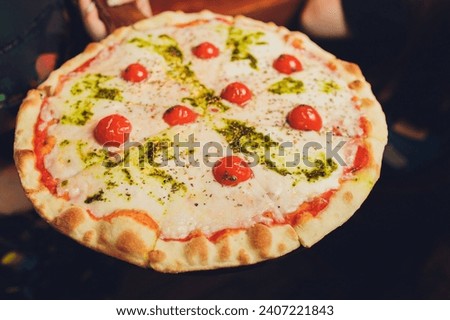 Young woman holding plate with tasty pizza, close up view