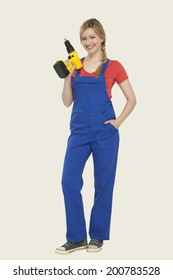 Young Woman Holding Power Drill Smiling