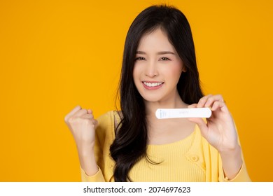 Young Woman holding Rapid Antigen Test kit with Negative result during swab COVID-19 testing Girl get happy that she does not get sick Coronavirus Self nasal or Home test Home Isolation concept