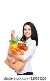 Young Woman Holding A Shopping Bag Full Of Vegetables Groceries, Happy Female Isolated On White Background