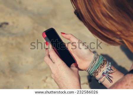 young woman holding smartphone