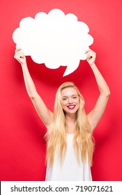 Young Woman Holding A Speech Bubble On A Solid Background