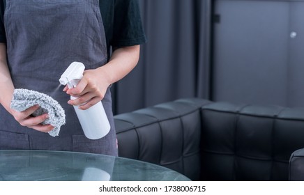 Young Woman Is Holding Spray Bottle, Rag To Clean, Wipe Down Office Metal Cabinet Shelf Accommodation Surface, Close Up, Lifestyle, Concept Of Antibacterial.