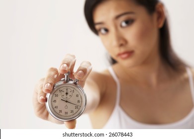 Young Woman Holding A Stop Watch