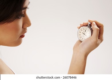 Young Woman Holding A Stop Watch