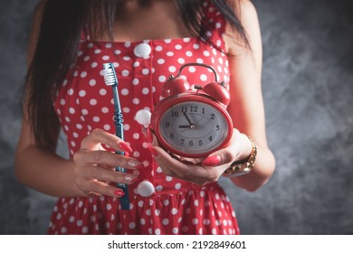 Young Woman Holding Toothpaste And Brush