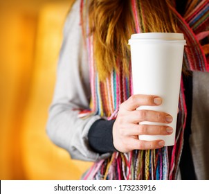 Young Woman Holding A Tumbler Of Coffee In Cafe.