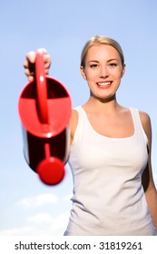 Young Woman Holding Watering Can