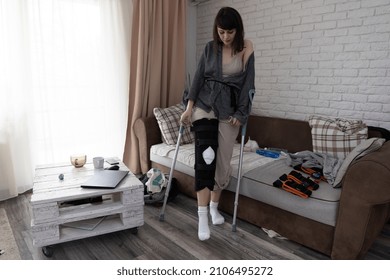 Young Woman At Home Recovering From An ACL Surgery.