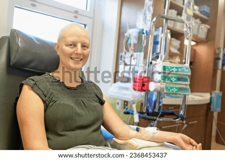 A Young woman in hospital bed suffering from breast cancer receiving treatment