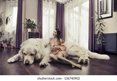 Young Woman Hugging Big Dog