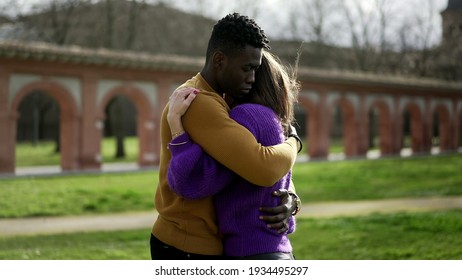 Young woman hugging male friend - Shutterstock ID 1934495297